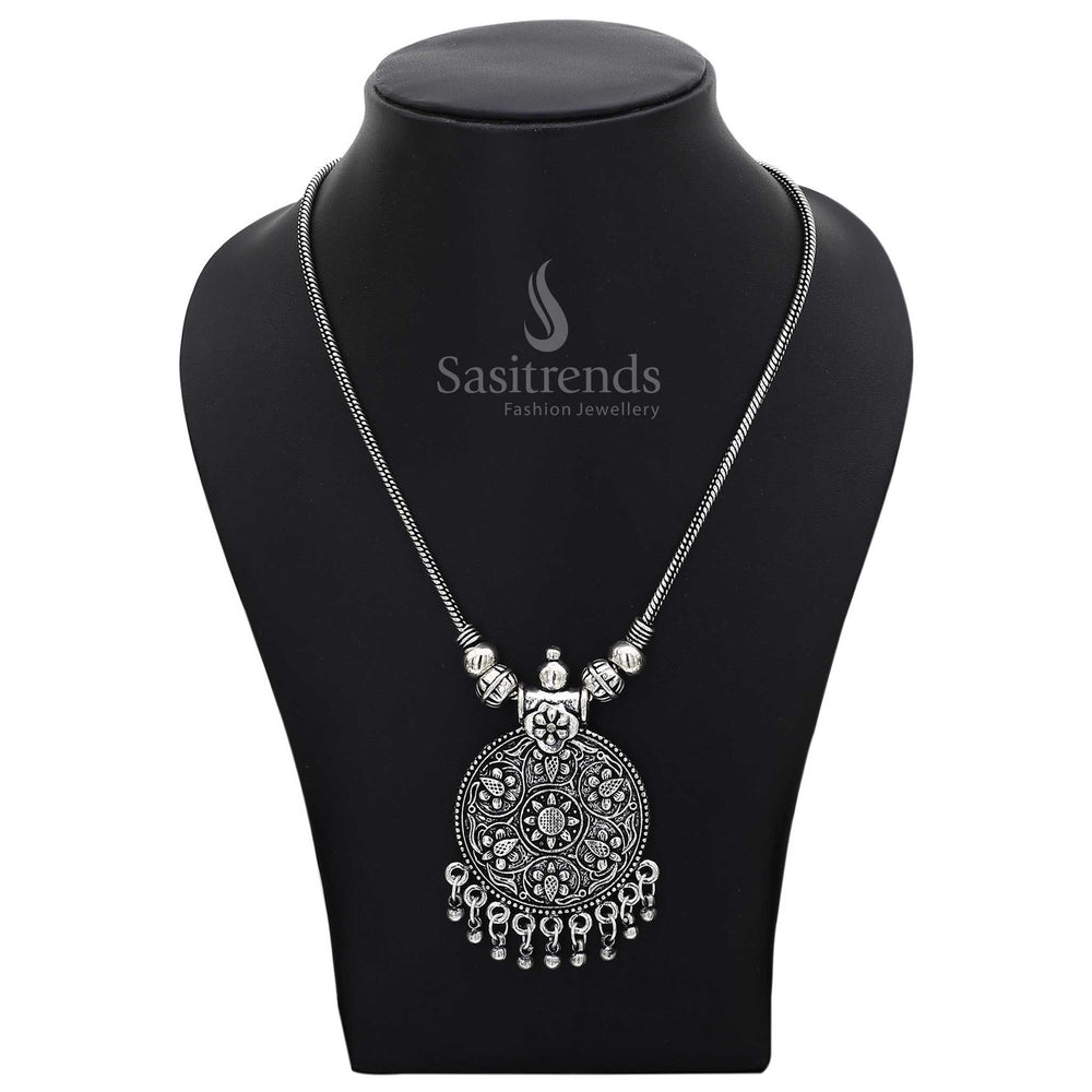 Oxidised silver necklace with a round floral pendant and antique-finished ball droplets – a traditional jewellery piece radiating rustic elegance, ideal for festive functions and cultural attire – Sasitrends