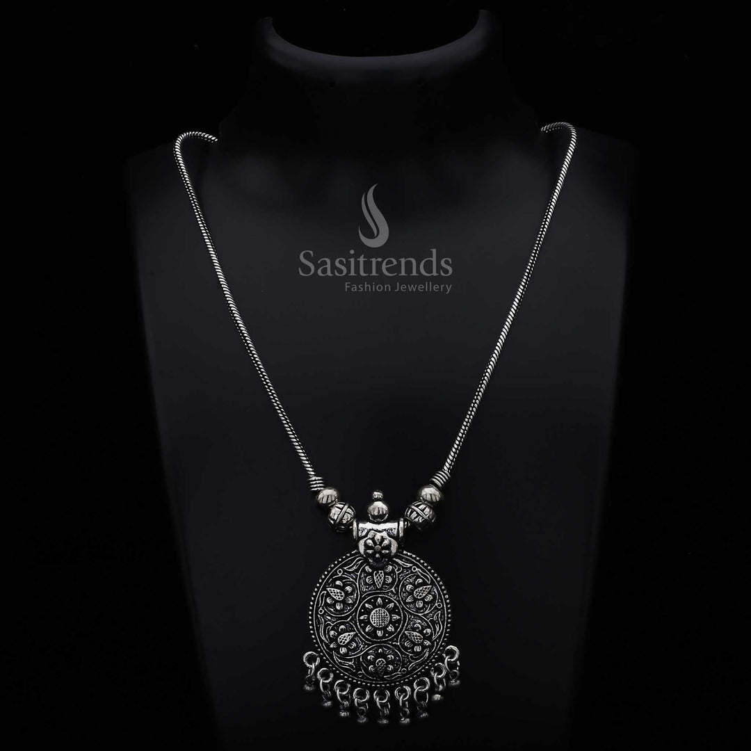 Classic oxidised silver chain necklace featuring an intricately detailed round floral pendant and hanging spherical beads – a timeless tribal-inspired jewellery design suited for ethnic celebrations and everyday elegance – Sasitrends
