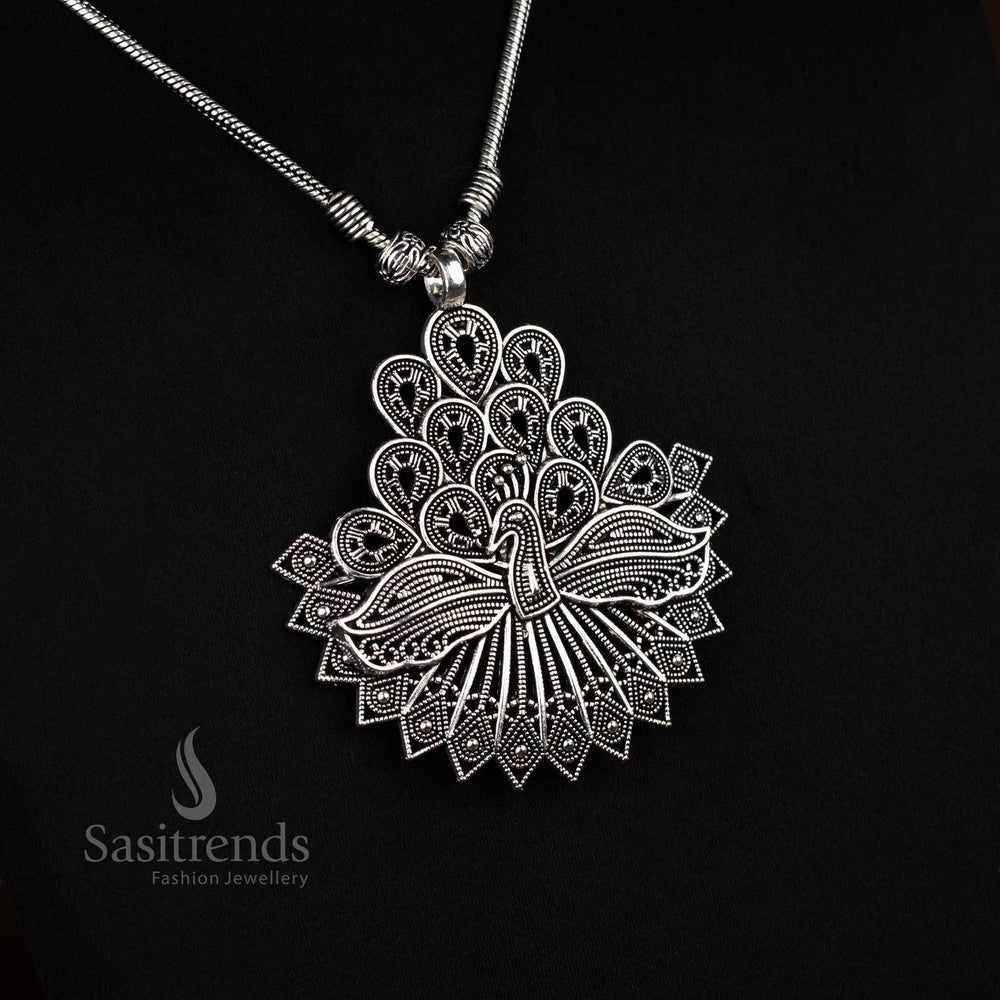 Elegant German silver oxidised chain necklace with antique feather peacock pendant, a traditional cultural jewellery piece for festive occasions – Sasitrends