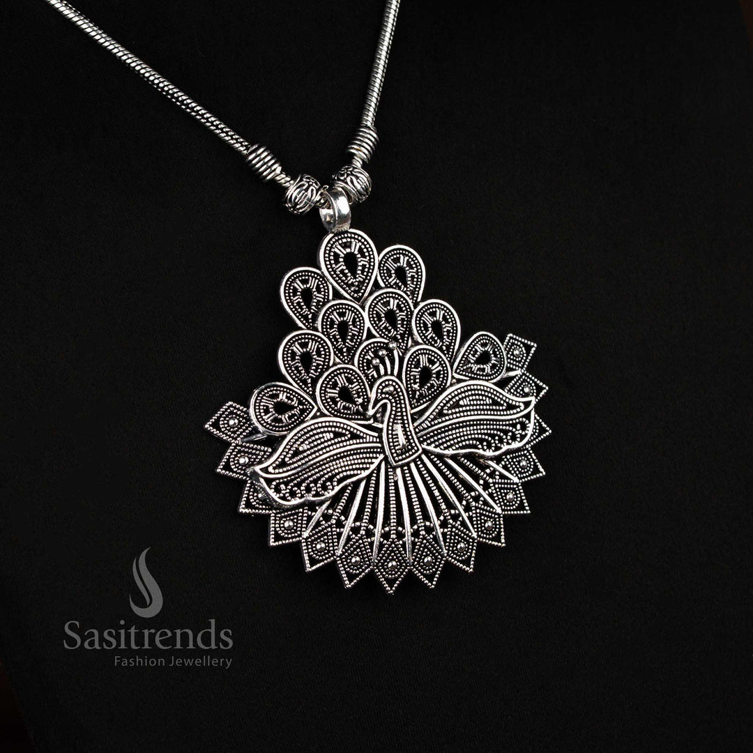 Elegant German silver oxidised chain necklace with antique feather peacock pendant, a traditional cultural jewellery piece for festive occasions – Sasitrends