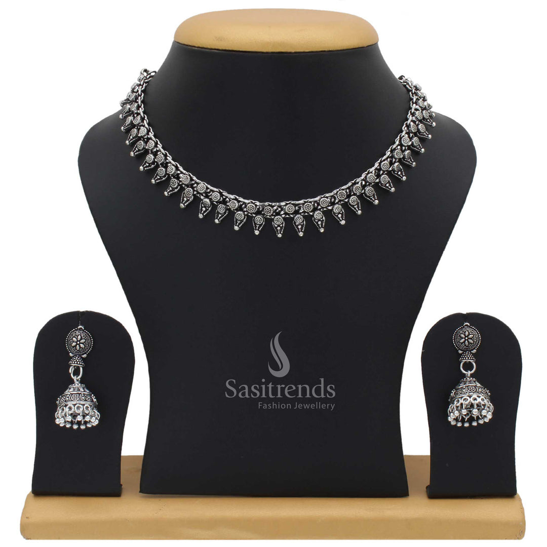 Taruni oxidised silver choker jewellery set with jhumka for women featuring tribal motif and boho fusion touch with vintage engraved floral accents - Sasitrends
