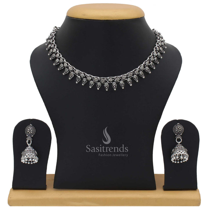 Taruni oxidised silver choker jewellery set with jhumka for women featuring tribal motif and boho fusion touch with vintage engraved floral accents - Sasitrends