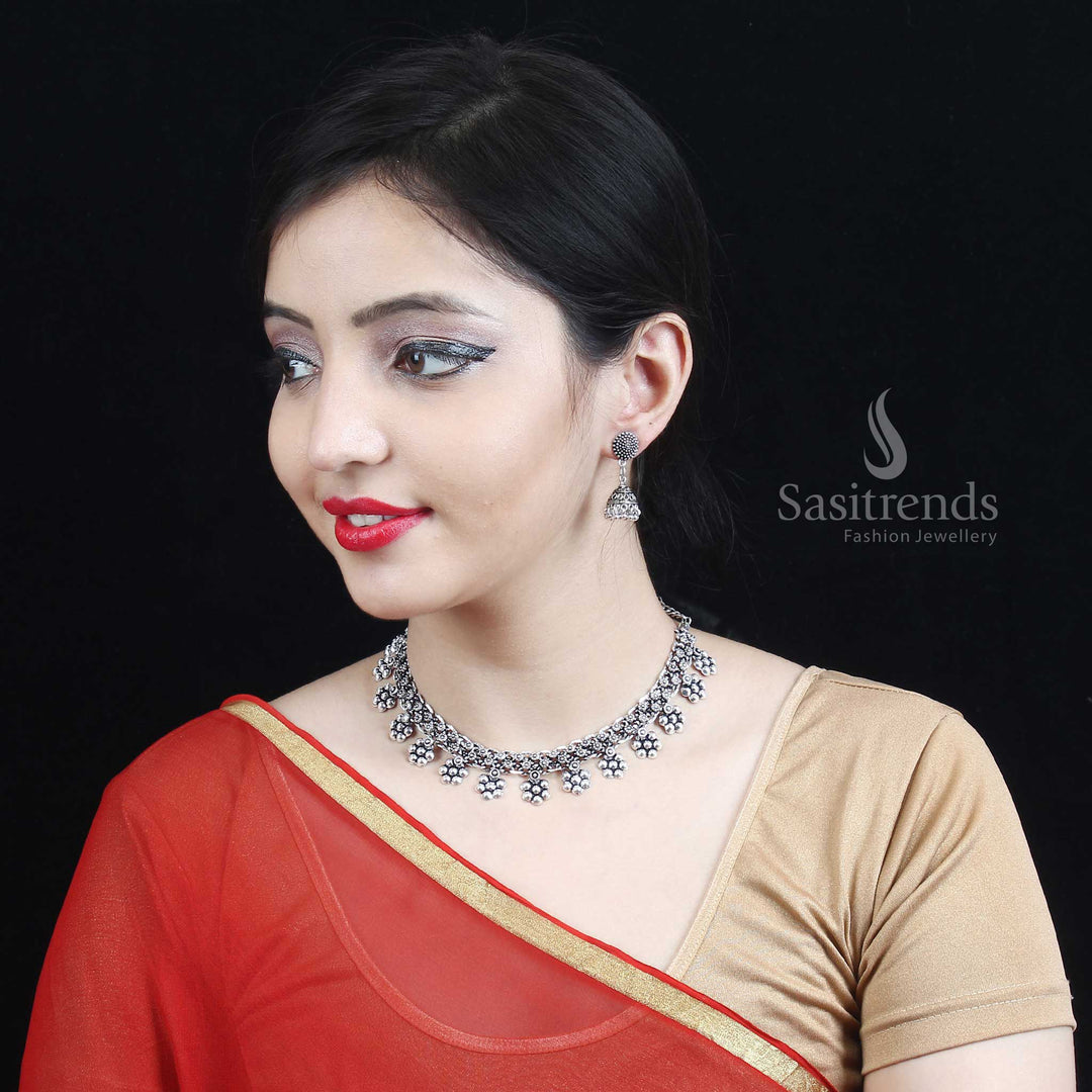 Boho ethnic Oxidised German Silver Necklace and Earrings Jewellery Set designed with intricate floral patterns and soft pearl charms—perfect for women and girls seeking artisanal style with a graceful flair – Sasitrends