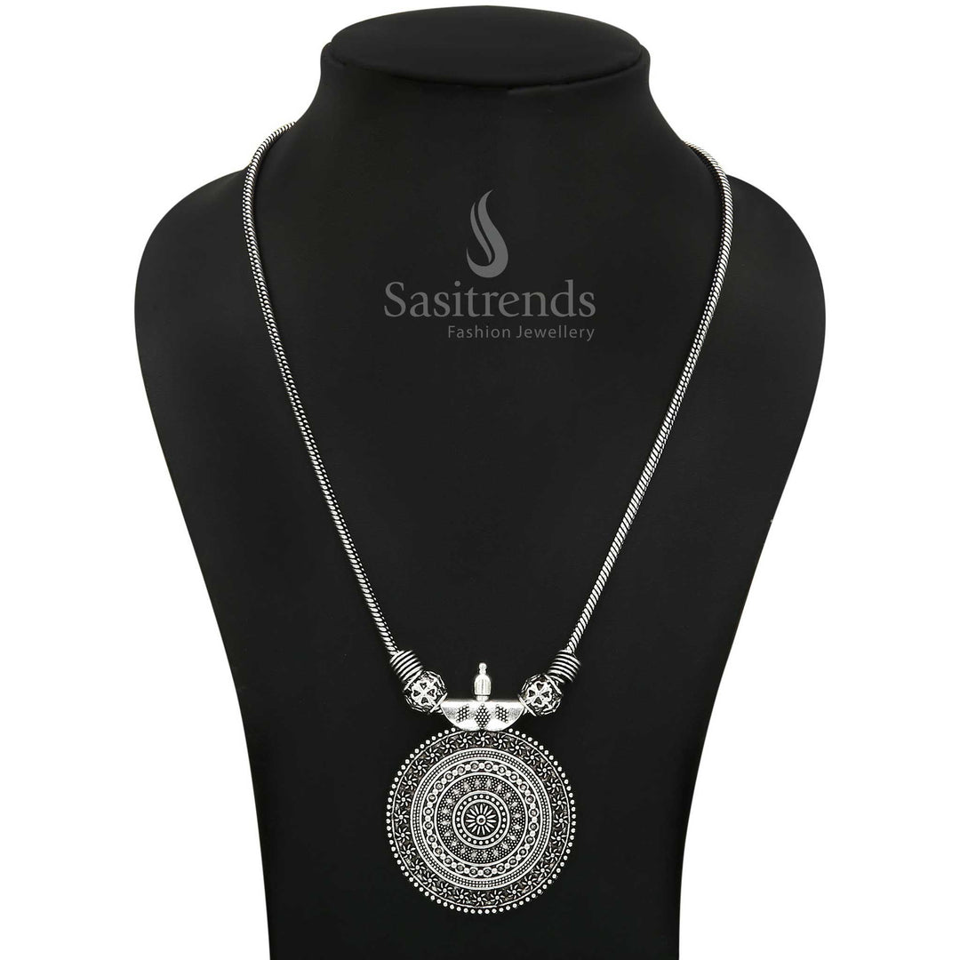 Eternal grace in oxidised silver with the Roopasi necklace, showcasing a round chakra pendant – a fusion of vintage tribal charm and traditional styling for everyday ethnic wear – Sasitrends