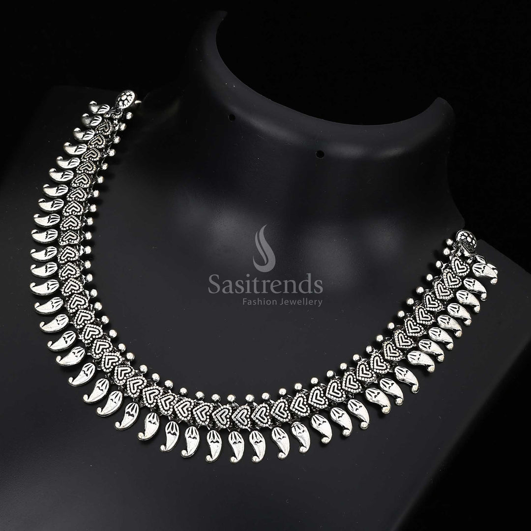 Sacred threads of heritage – this Kolhapuri oxidised fusion necklace features an antique symbolic pendant and classic folk jewellery construction – Sasitrends