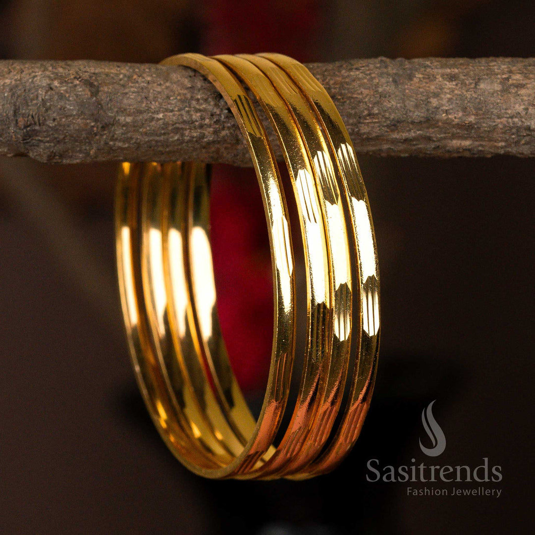 Smooth and reflective set of 4 micro gold-plated bangles with a minimalist design