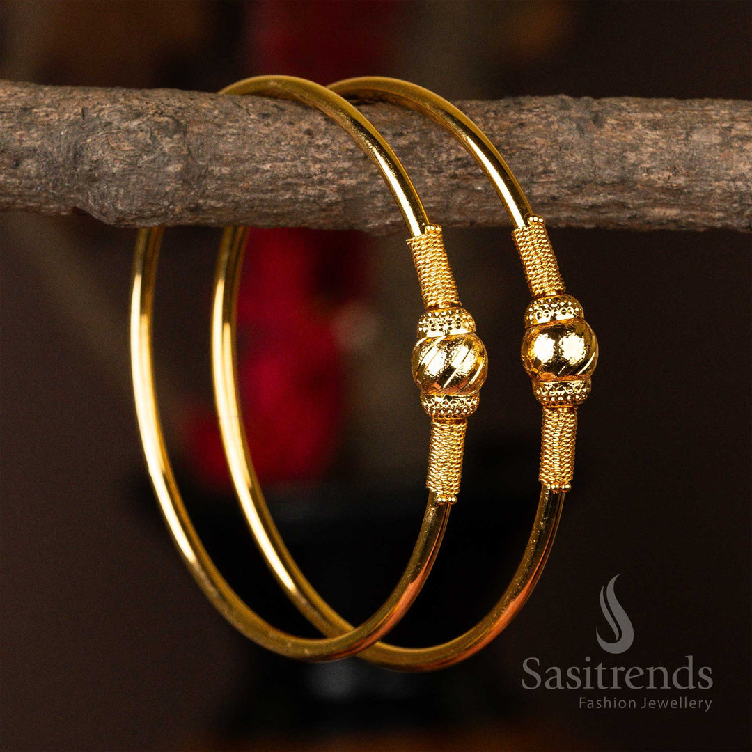Gold-plated kada bangles with distinctive textured spheres - Sasitrends