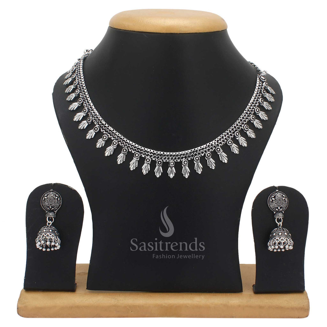 Majestic tradition inspired oxidised silver jewellery set with intricately carved patterns and classic jhumka earrings – a cultural ensemble crafted for festive grace – Sasitrends