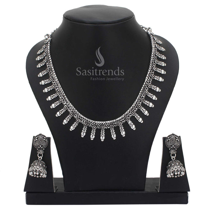 Artisan crafted oxidised silver jewellery set highlighted with tribal patterns and elegant jhumkas – an exquisite pick for traditional cultural ensembles – Sasitrends