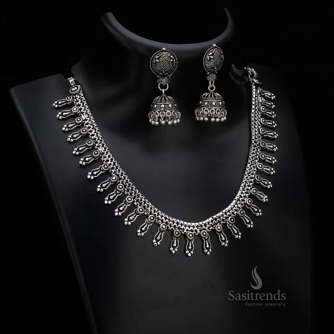 Floral vintage oxidised silver jewellery set with artistically stone-inlaid jhumka earrings – designed to elevate traditional cultural attire – Sasitrends