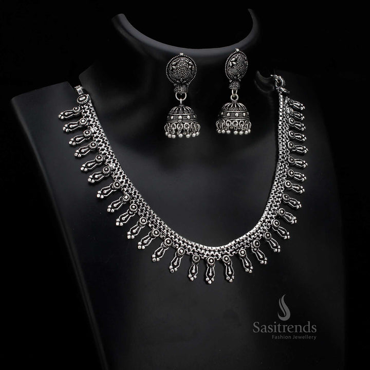 Floral vintage oxidised silver jewellery set with artistically stone-inlaid jhumka earrings – designed to elevate traditional cultural attire – Sasitrends