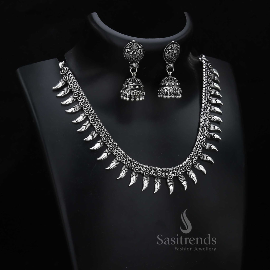 Temple charm shines through this oxidised silver jewellery set with paisley motifs and classic jhumkas – ideal for cultural ceremonies and festivals – Sasitrends