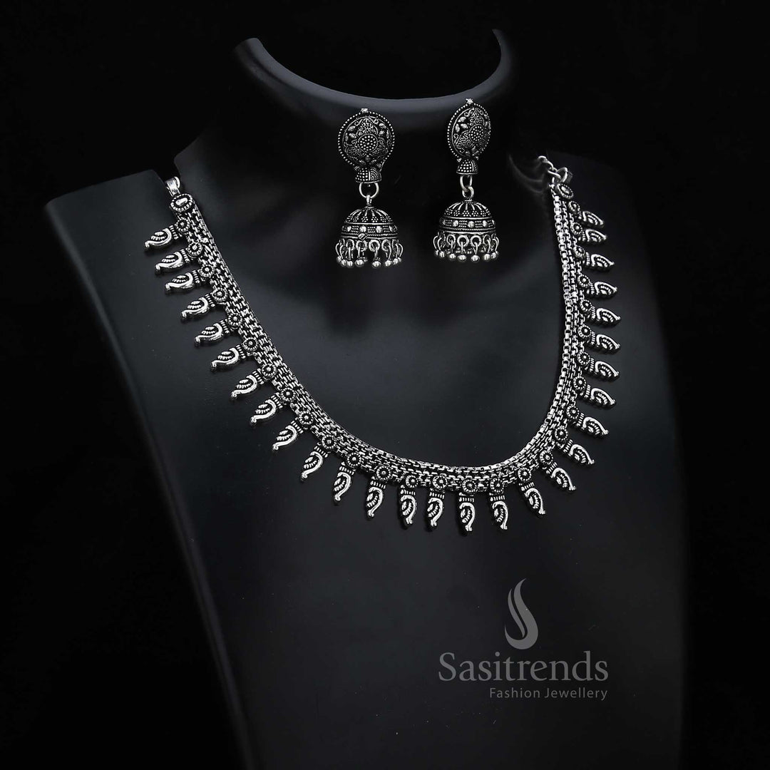 Folk-inspired oxidised silver jewellery set with statement designer jhumka earrings and tribal pattern fusion – a bold cultural jewellery piece – Sasitrends