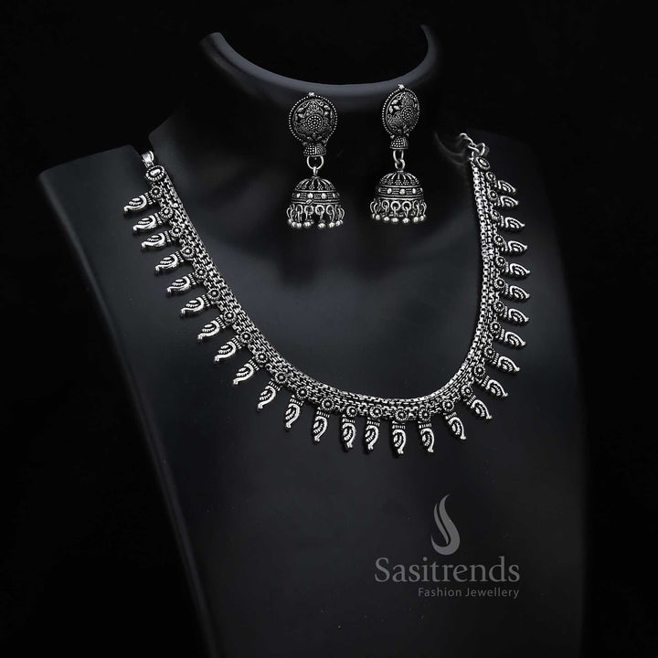 Folk-inspired oxidised silver jewellery set with statement designer jhumka earrings and tribal pattern fusion – a bold cultural jewellery piece – Sasitrends