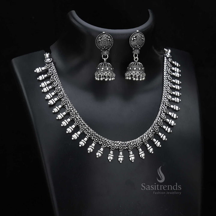 Artisan finish oxidised silver jewellery set with bell-shaped jhumkas and ornate texturing – suited for cultural occasion wear with traditional depth – Sasitrends