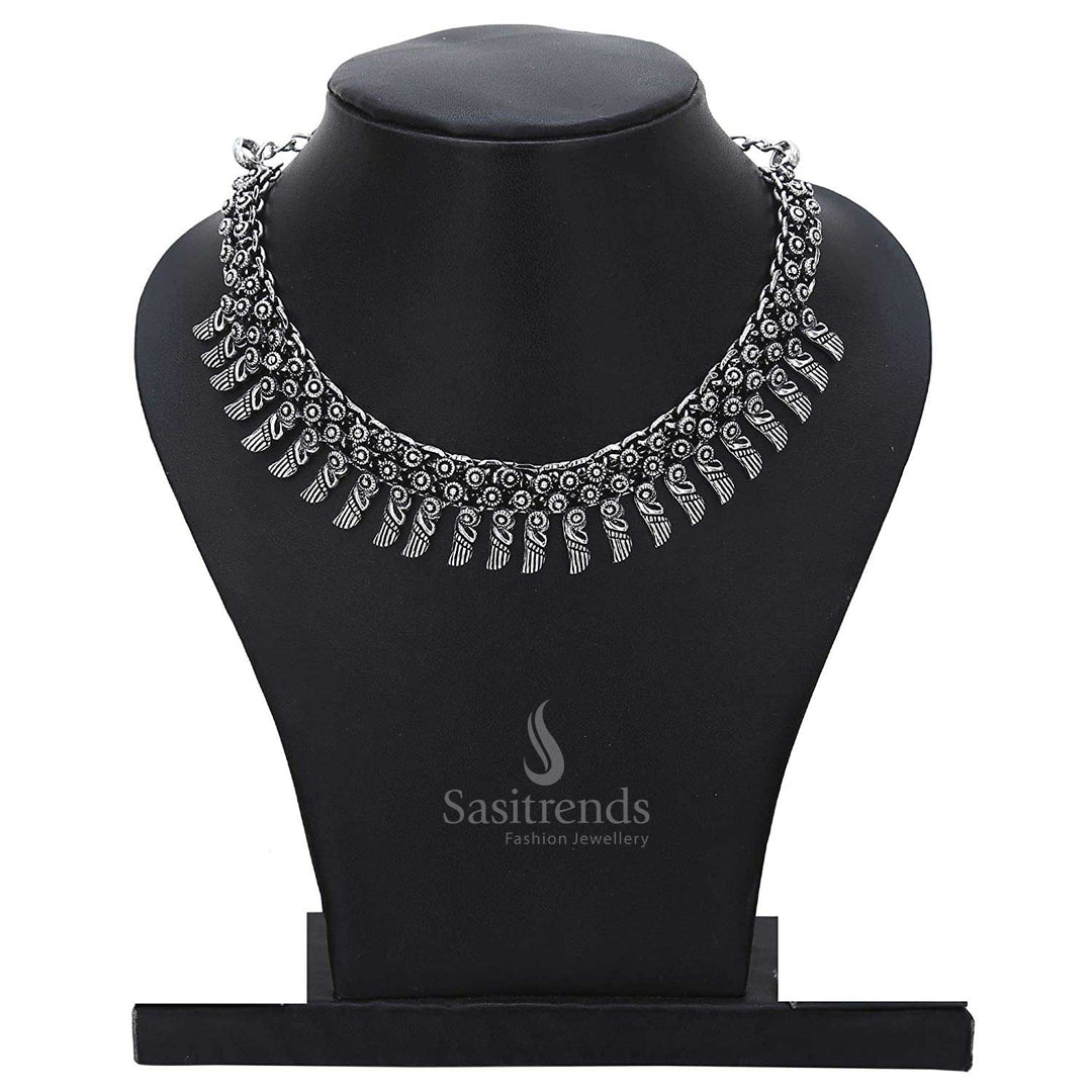 Moon dance of folklore and elegance – this oxidised necklace showcases crescent pendants, dotted sun spikes, and dangling folk charms for rustic tribal jewellery allure – Sasitrends