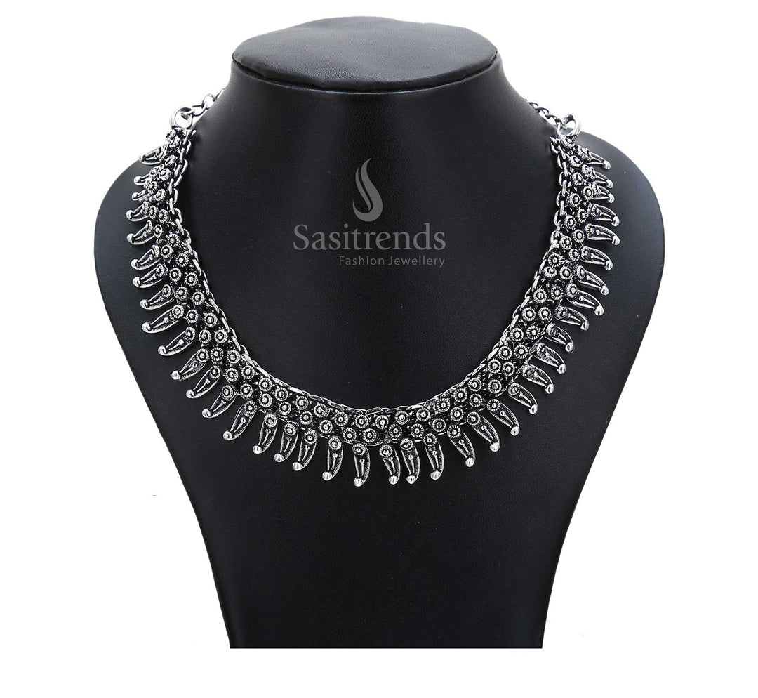 Ancestor melody plays on in this oxidised chain necklace with rustic drum-shaped pendants and ethnic circular motifs – inspired tribal jewellery – Sasitrends