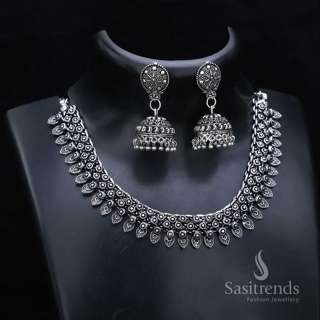 Floral glory shines through this oxidised silver jewellery set with carved necklace and classic jhumka drops – inspired by ancestral beauty – Sasitrends