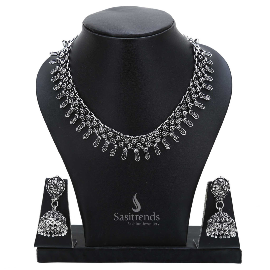Antique essence defines this oxidised silver necklace set with round jhumka earrings and ethnic accents – perfect for traditional jewellery lovers – Sasitrends