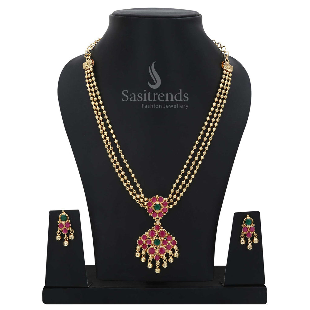 Traditional festive wear jewellery set with ruby-green diamond pendant and three rows of glowing golden beads – micro gold plated craftsmanship for vibrant ethnic occasions – Sasitrends