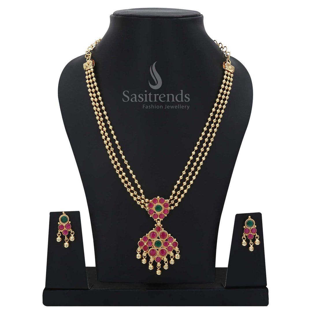 Traditional festive wear jewellery set with ruby-green diamond pendant and three rows of glowing golden beads – micro gold plated craftsmanship for vibrant ethnic occasions – Sasitrends