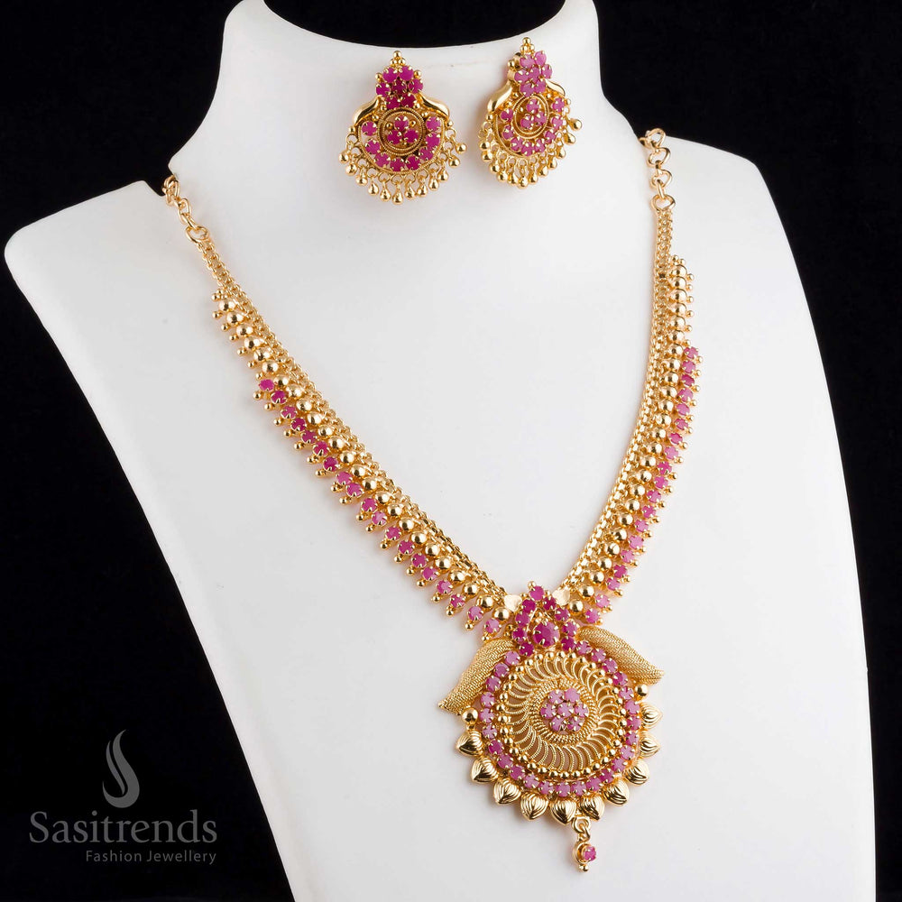 Exquisite regal ornate micro gold plated tilak pendant ruby necklace set with earrings, designed for ethnic occasions with a royal touch - Sasitrends