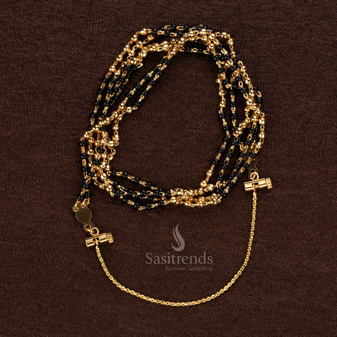 Stunning double-layered Thali Saradu chain featuring intricate black beads and golden accents, ideal for ethnic ceremonies and special events - Sasitrends