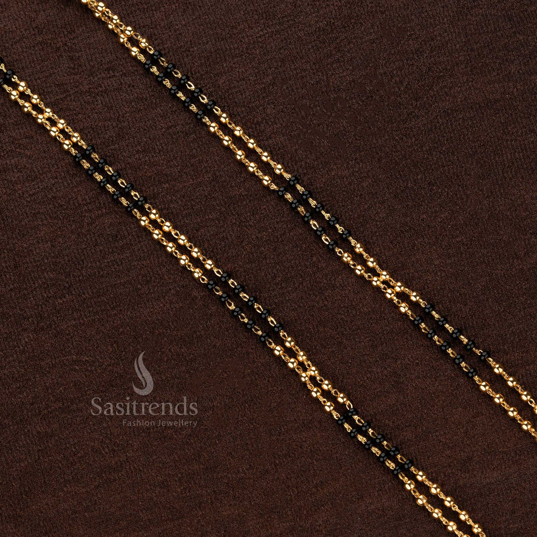 Exquisite double-layered black beaded Thali Saradu chain adorned with shimmering gold beads, crafted for timeless traditional elegance - Sasitrends