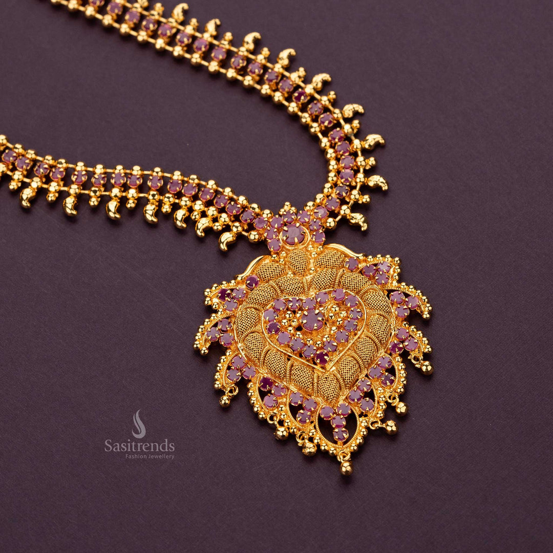 Majestic long haram necklace in gold finish with AD stones and ornate pendant