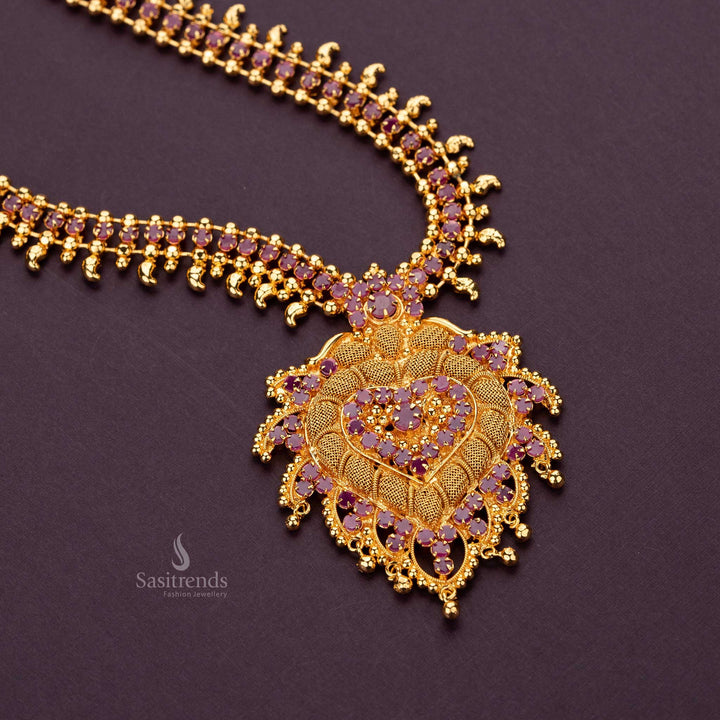 Majestic long haram necklace in gold finish with AD stones and ornate pendant