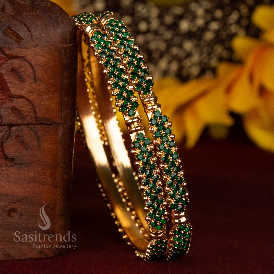 Vibrant micro gold plated bangles with dense green stone arrangement and festive traditional styling – one gram guaranteed jewellery for grand celebrations and temple looks – Sasitrends