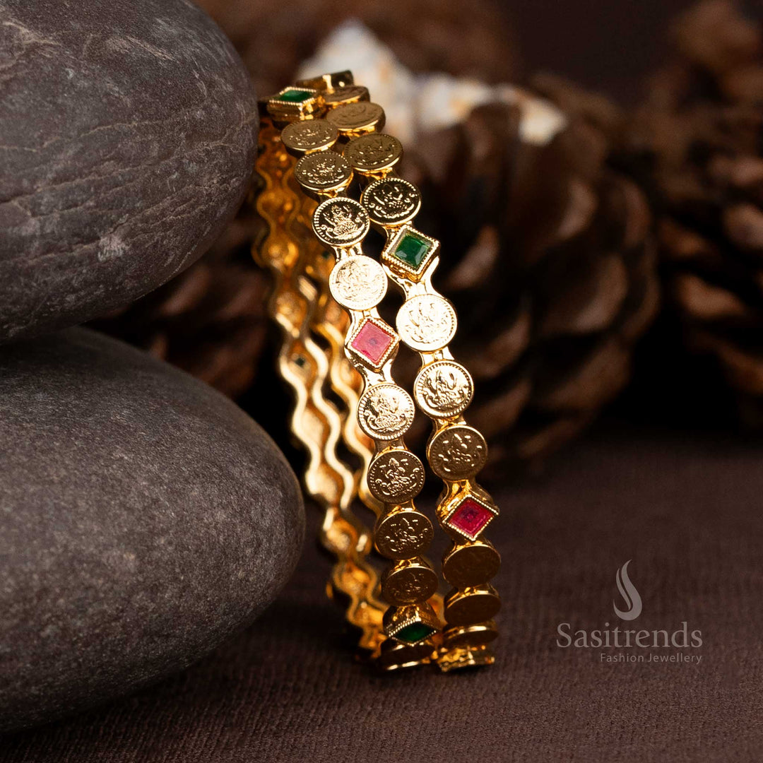 Wavy gold plated Lakshmi coin bangles with stone accents by Sasitrends