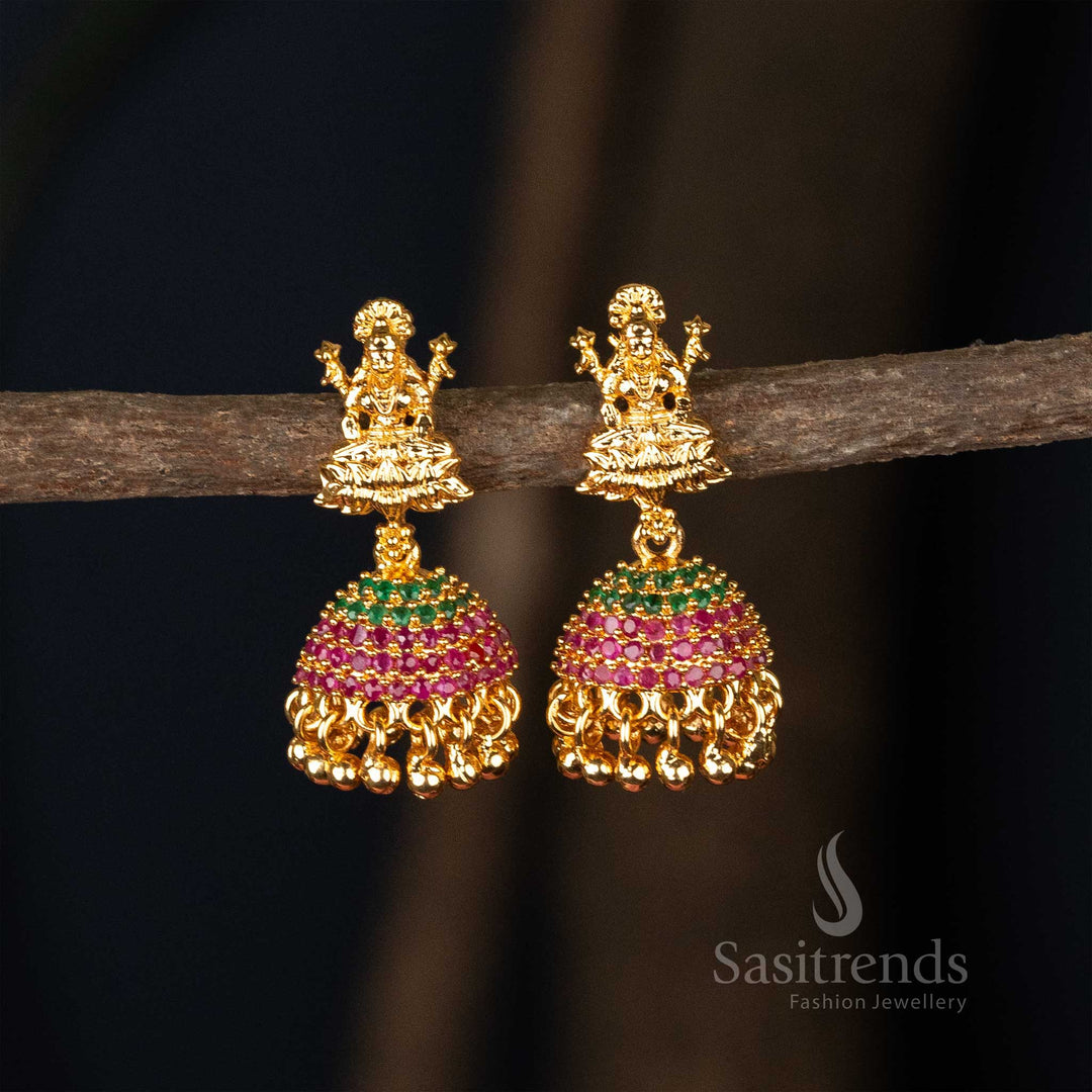Majestic ruby-green colour micro gold plated flower designer jhumkas earrings enhanced with divine god motif, a perfect choice for traditional wedding wear - Sasitrends