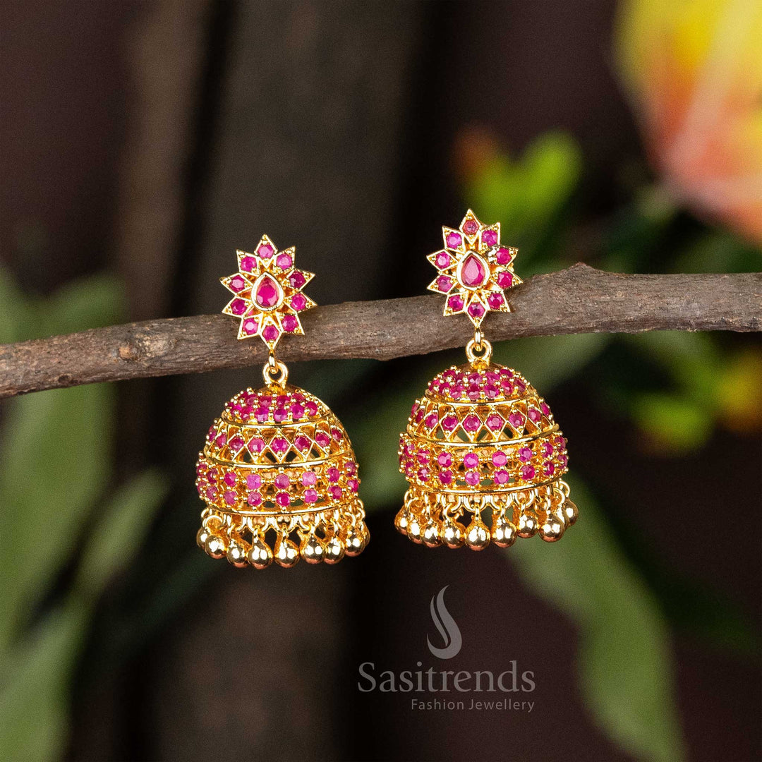 Radiant ruby micro gold plated AD stone jhumka earrings in traditional style, making an enchanting jewellery choice for wedding and festive wear - Sasitrends