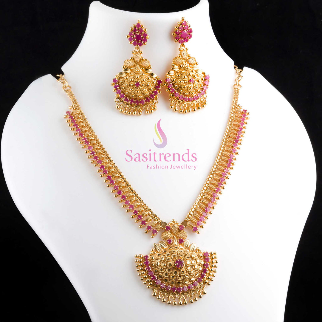 Stunning ruby Tilak motif micro gold polished necklace and earrings jewellery set featuring American diamond sparkle, ideal for bridal style and grand celebrations – Sasitrends
