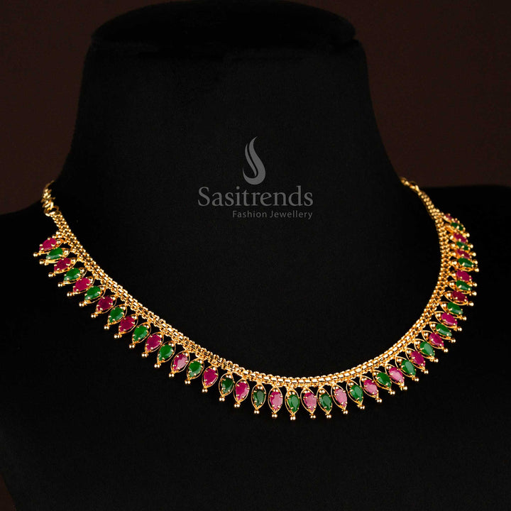 Ruby-green tilak motif micro gold-plated necklace with American diamond accents, an elegant traditional jewellery set for vibrant ethnic wear – Sasitrends