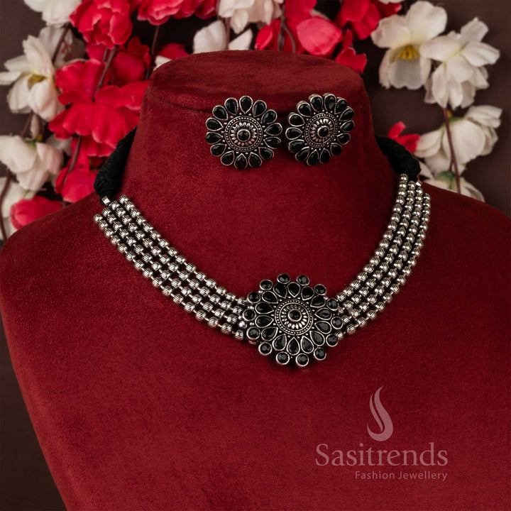 Magnificent oxidised German silver black stone studded floral pendant four-line ball choker necklace jewellery set designed to elevate ethnic charm for festive and Navaratri wear – Sasitrends