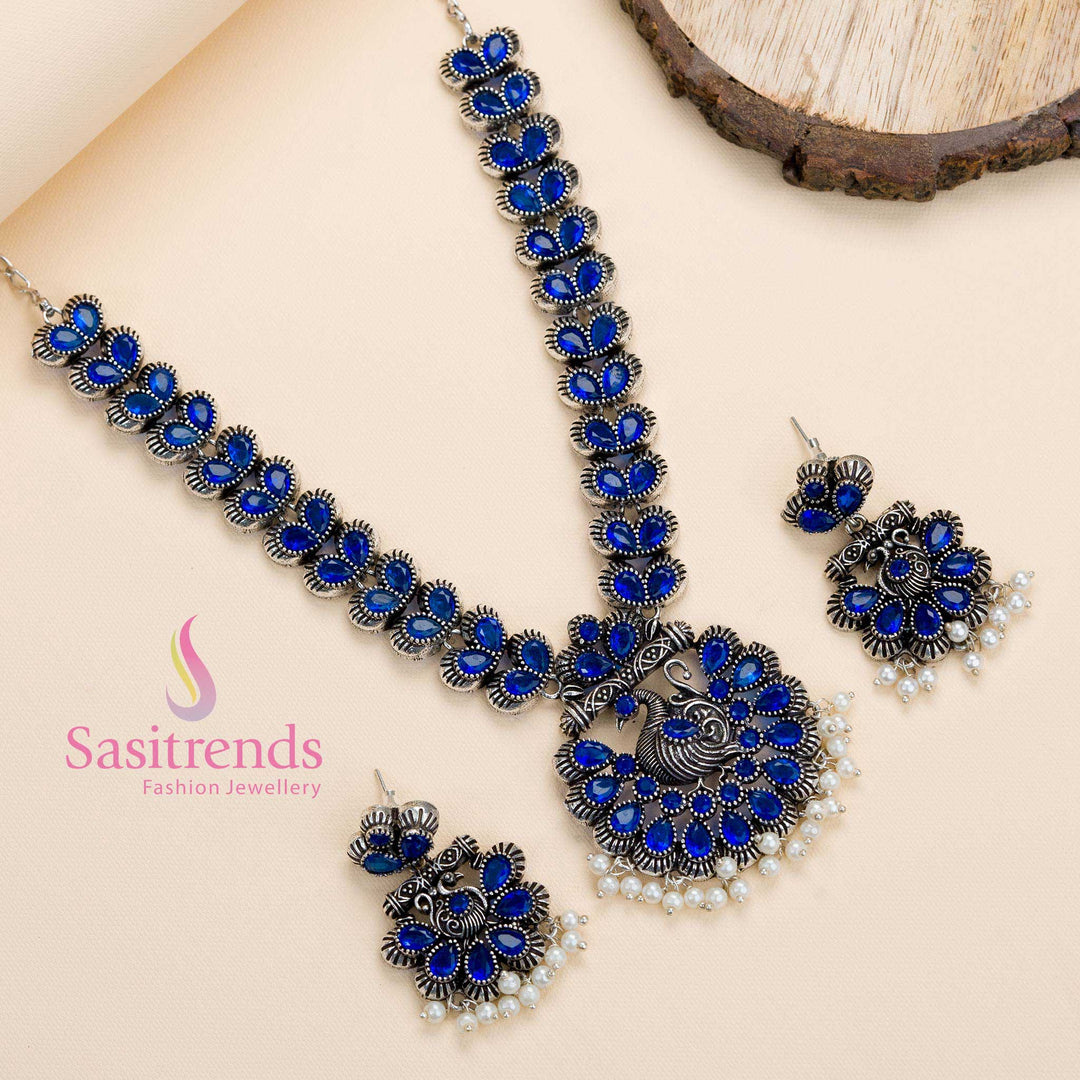 Oxidised antique-finish blue stone peacock necklace set with pearl earrings, a traditional party jewellery piece with a subtle modern twist – Sasitrends
