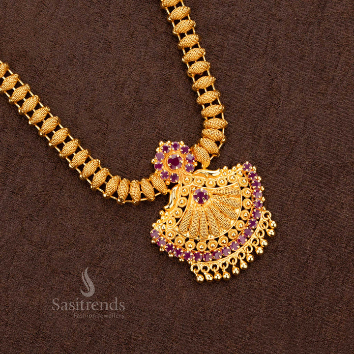 Exquisite handcrafted 1-gram micro gold-plated necklace featuring a stunning Tilak-shaped pendant adorned with radiant ruby AD stones, reflecting traditional elegance and charm - Sasitrends