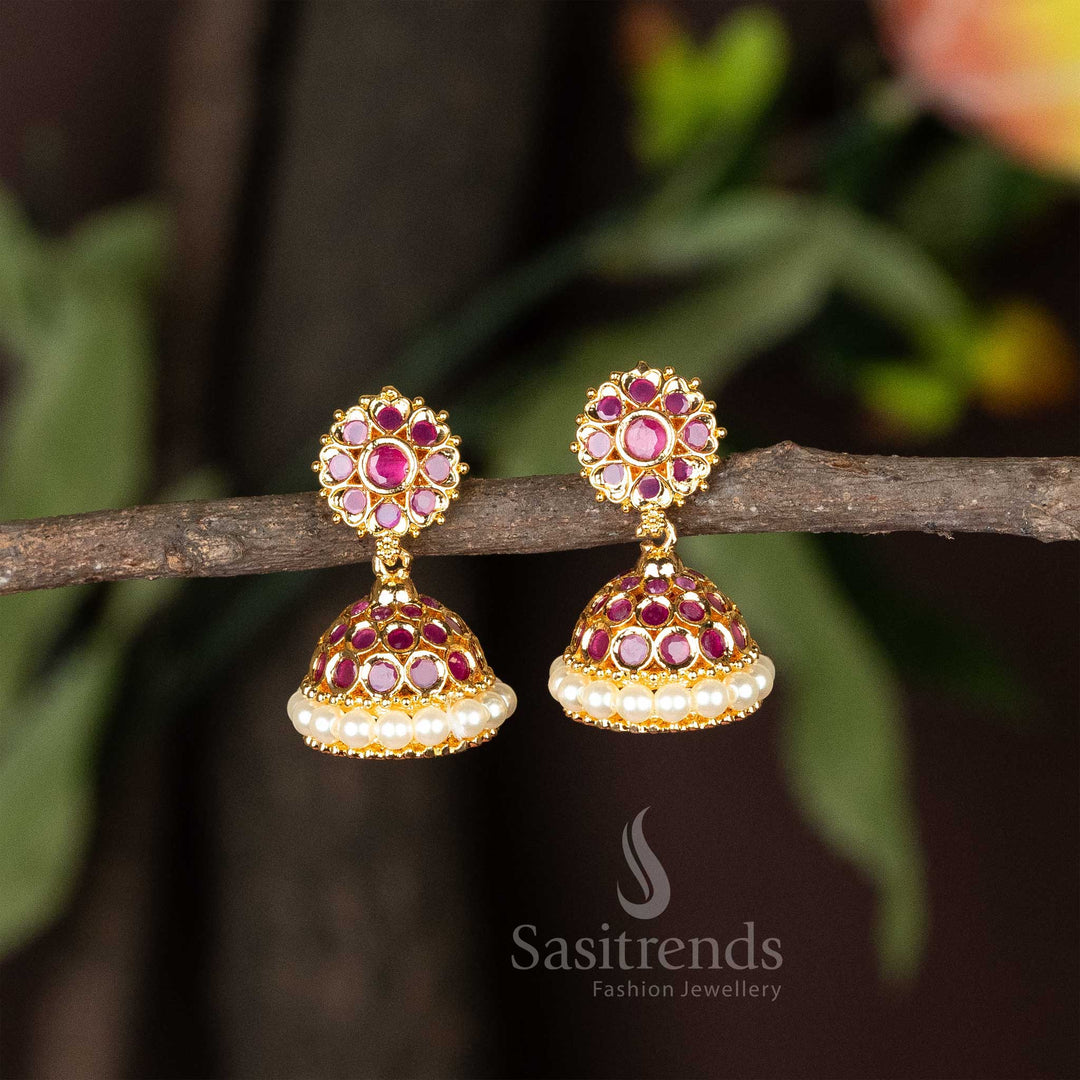 Stunning ruby-toned micro gold plated AD stone studded jhumka earrings with pearl hangings – A regal and traditional choice for festive jewellery elegance – Sasitrends