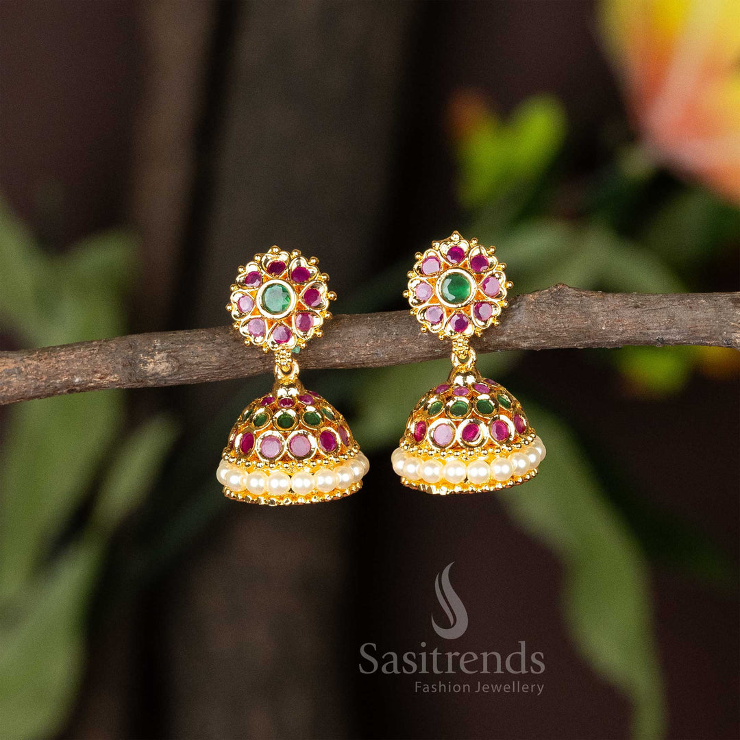 Ruby-green American Diamond studded temple-style jhumka earrings with a micro gold finish and delicate pearl hangings – An exquisite piece for classical Indian jewellery collections – Sasitrends