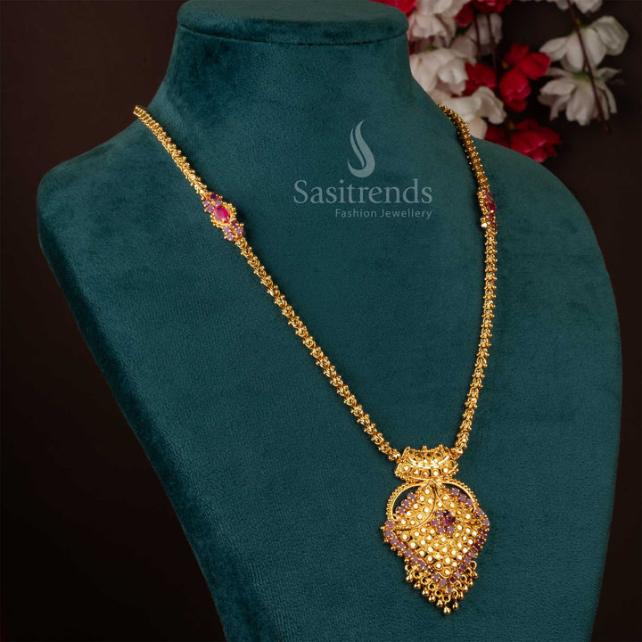 Graceful floral-inspired pendant necklace adorned with ruby stones in micro gold finish – ideal for cultural occasions and elegant South Indian bridal jewellery styling – Sasitrends