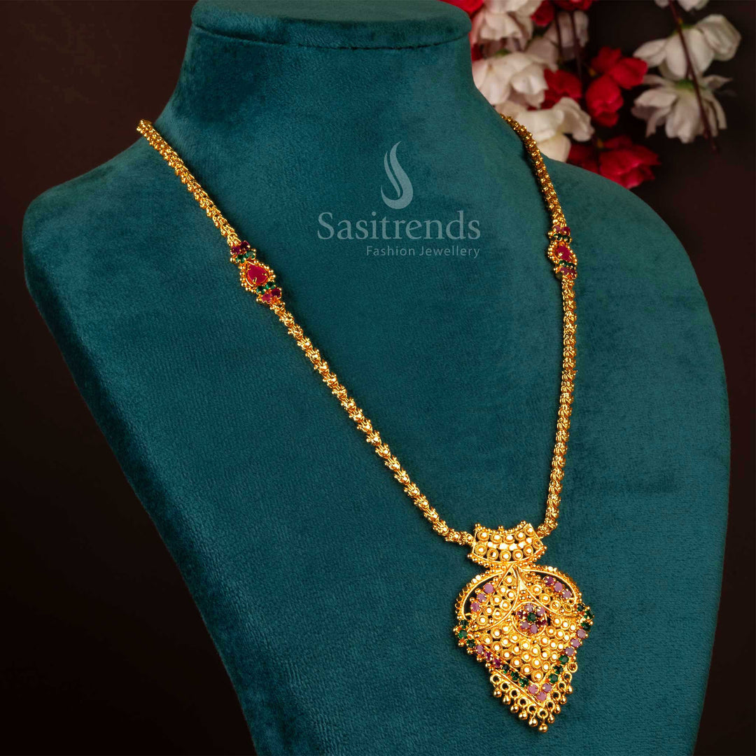 Ornate ruby-green necklace with floral pendant, finished in elegant micro gold – perfect for ethnic wear, bridal styling, and grand festive occasions – Sasitrends