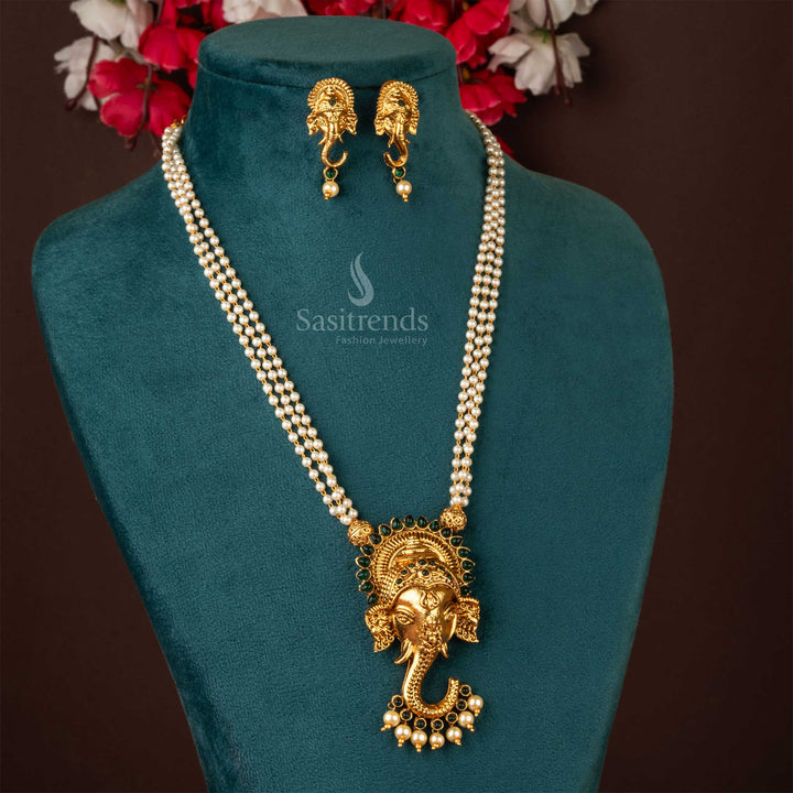 Royal Matte Gold Plated Temple Necklace Set – A magnificent Lord Ganesh-inspired jewellery piece enriched with dazzling green gemstones - Sasitrends
