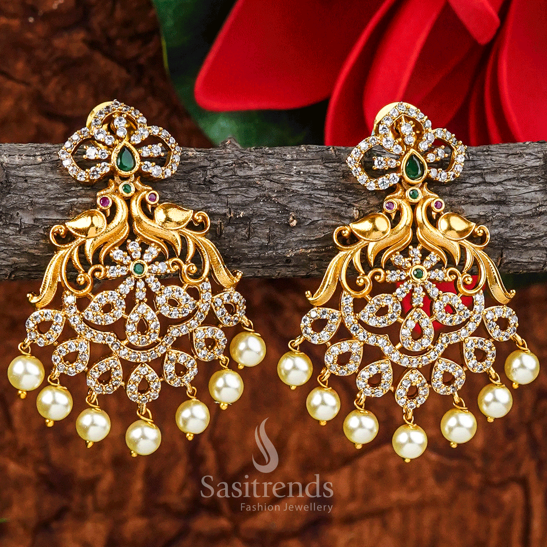 Exquisite Temple Matte Gold Plated Peacock Earrings With Sparkling AD Stones And Elegant Hanging Pearls – Traditional Bridal Jewellery Perfect For Sarees And Festive Occasions – Sasitrends