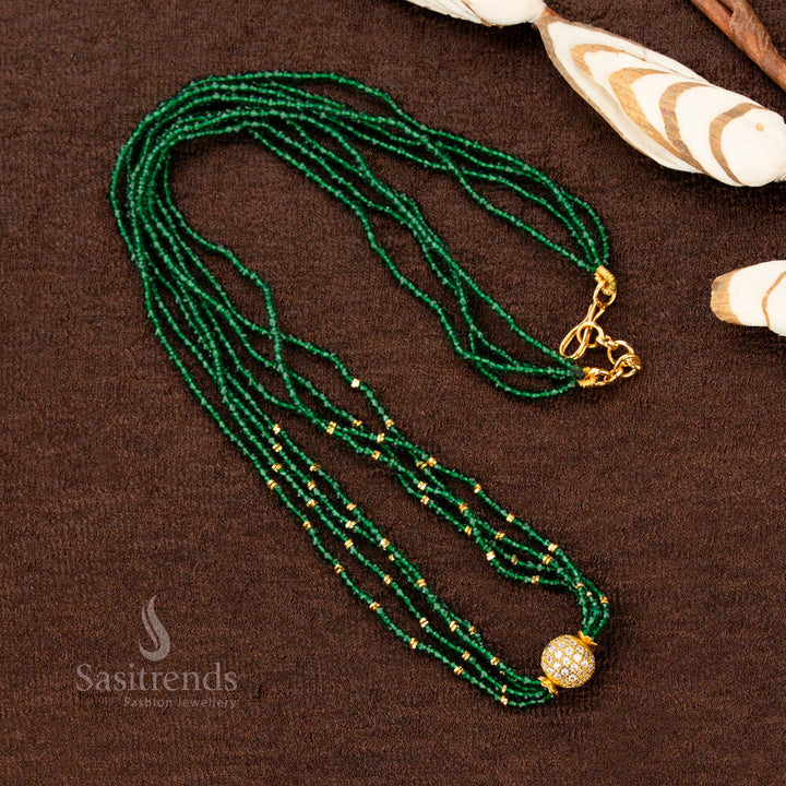 A luxurious one gram gold long necklace with a handcrafted pendant, embellished with a shimmering emerald green stone, perfect for royal-inspired jewellery collections - Sasitrends