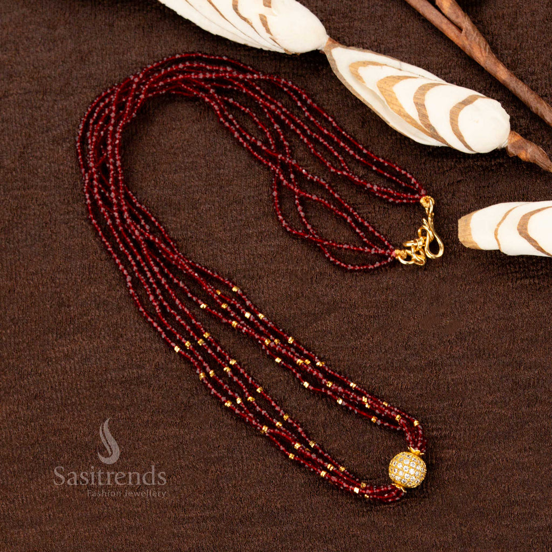 An elegant one gram micro gold plated long necklace featuring a grand pendant with rich maroon gemstone ornamentation, exuding warmth and regal charm - Sasitrends
