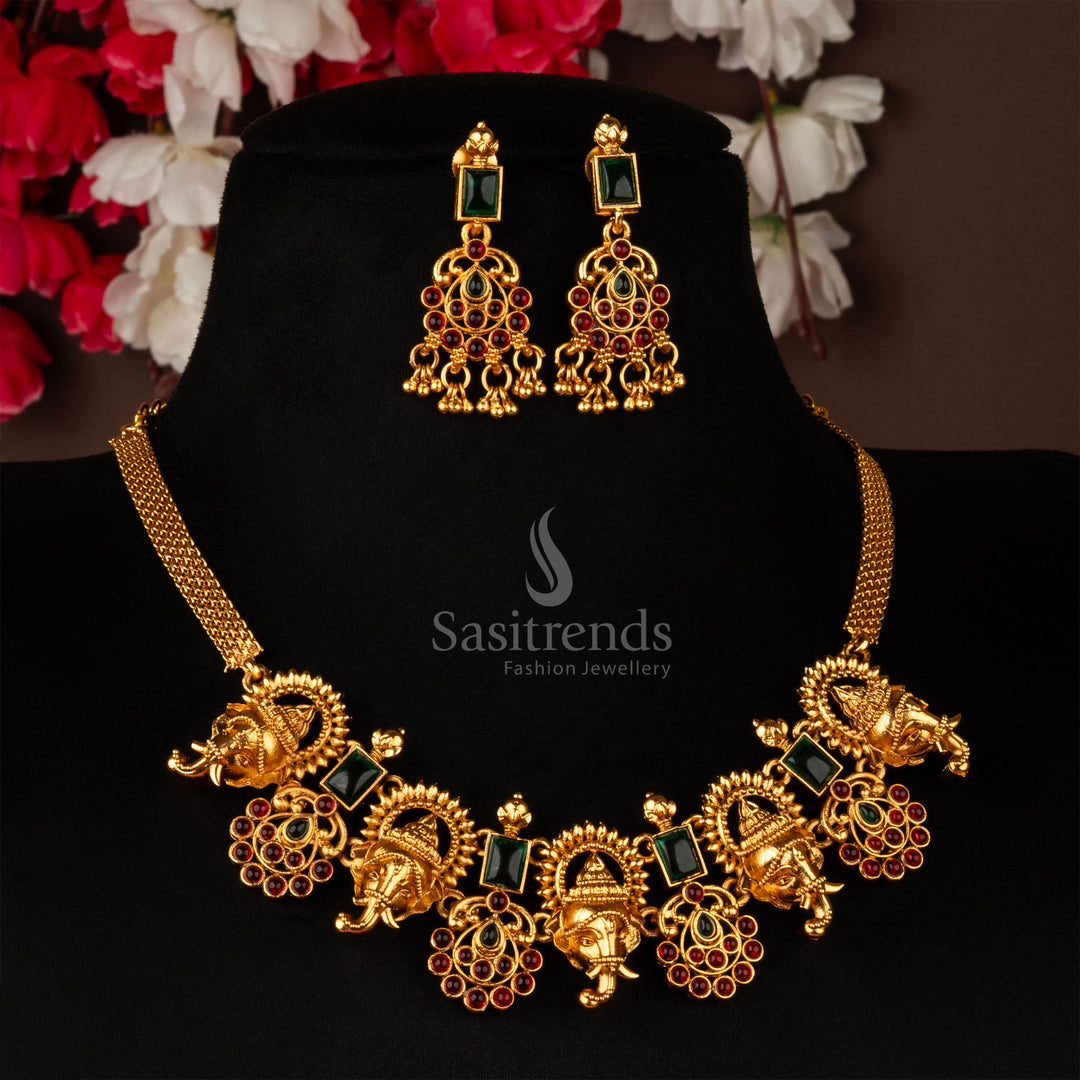 Classic temple-inspired choker necklace set in matte gold, featuring a stunning Ganesh pendant with ruby-green American diamond stones - Sasitrends