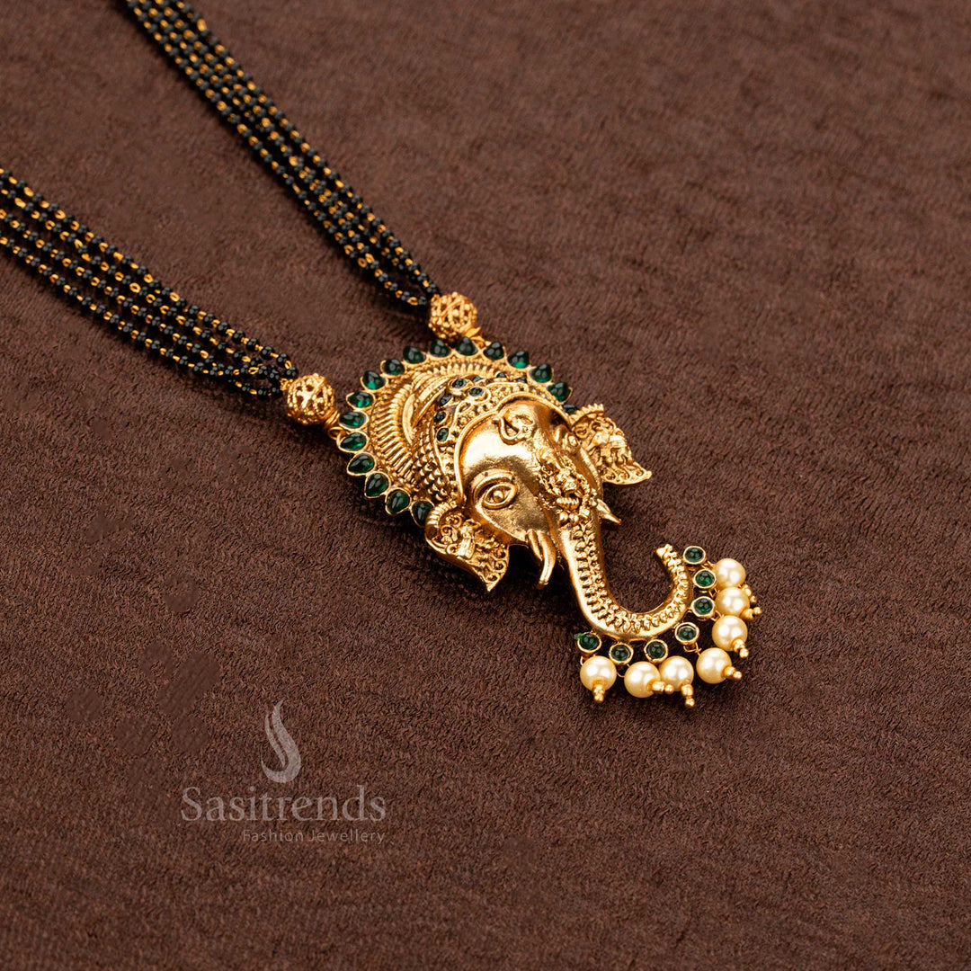 Handcrafted Ganesha mangalsutra in matte gold, featuring exquisite green stone embellishments — an authentic Indian jewellery set radiating purity and grace - Sasitrends