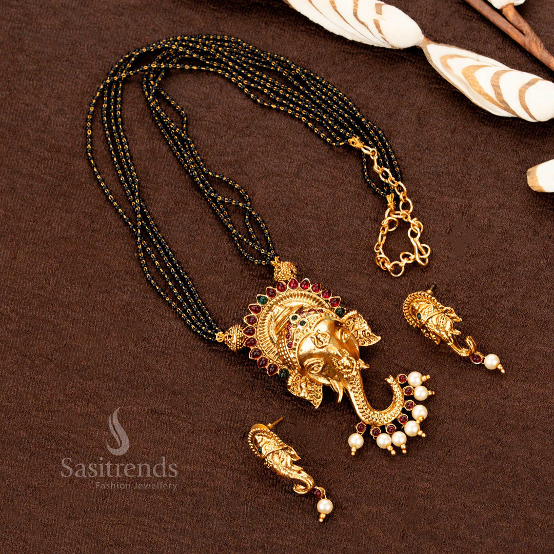 Traditional matte gold Ganesh pendant necklace mangalsutra featuring dual-hue ruby-green stone highlights, an iconic Indian jewellery set for grace and heritage - Sasitrends